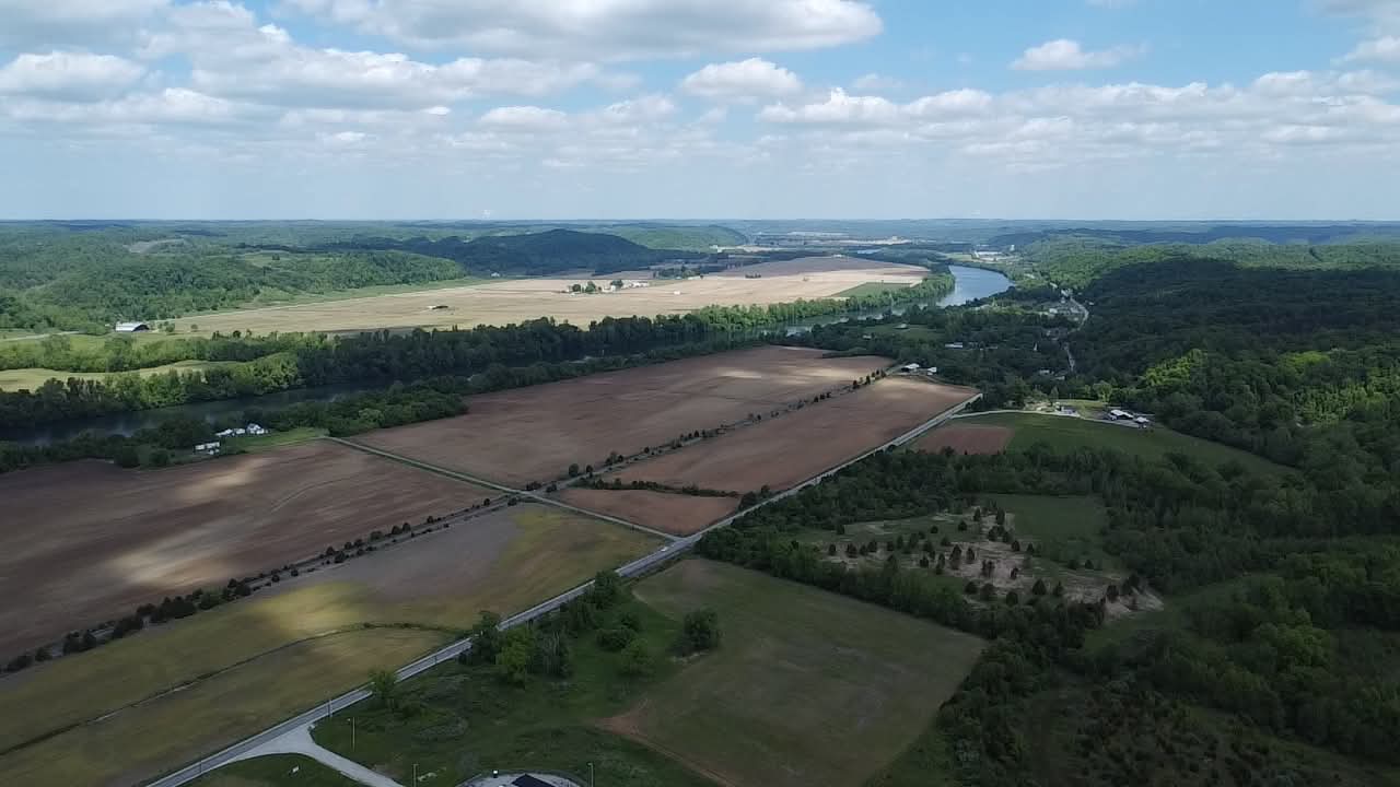 Aerial view of farmland, river, and wooded hills in Putnam County